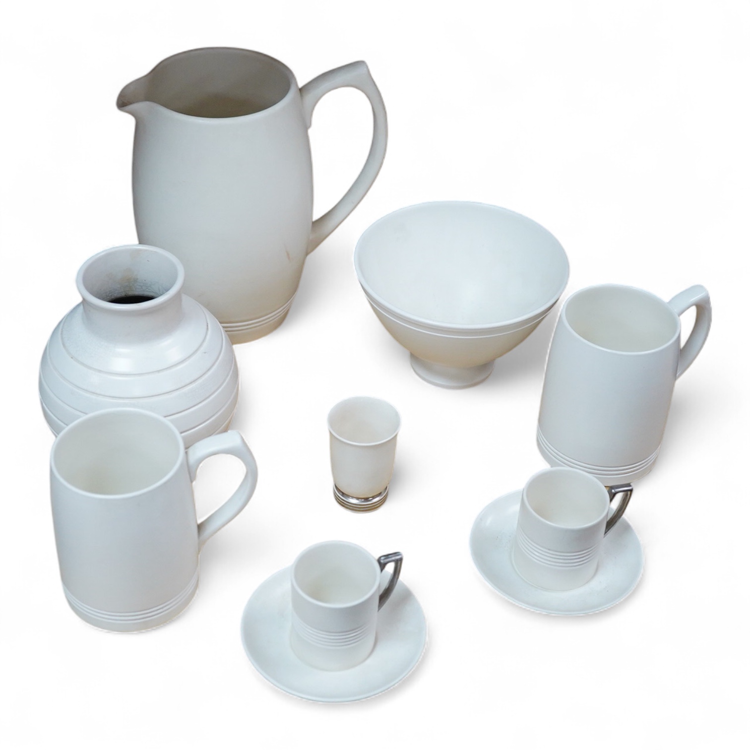 Keith Murray for Wedgwood, moonstone bowl, vase, jug, two mugs, coffee cups and small vase, largest 21cm high